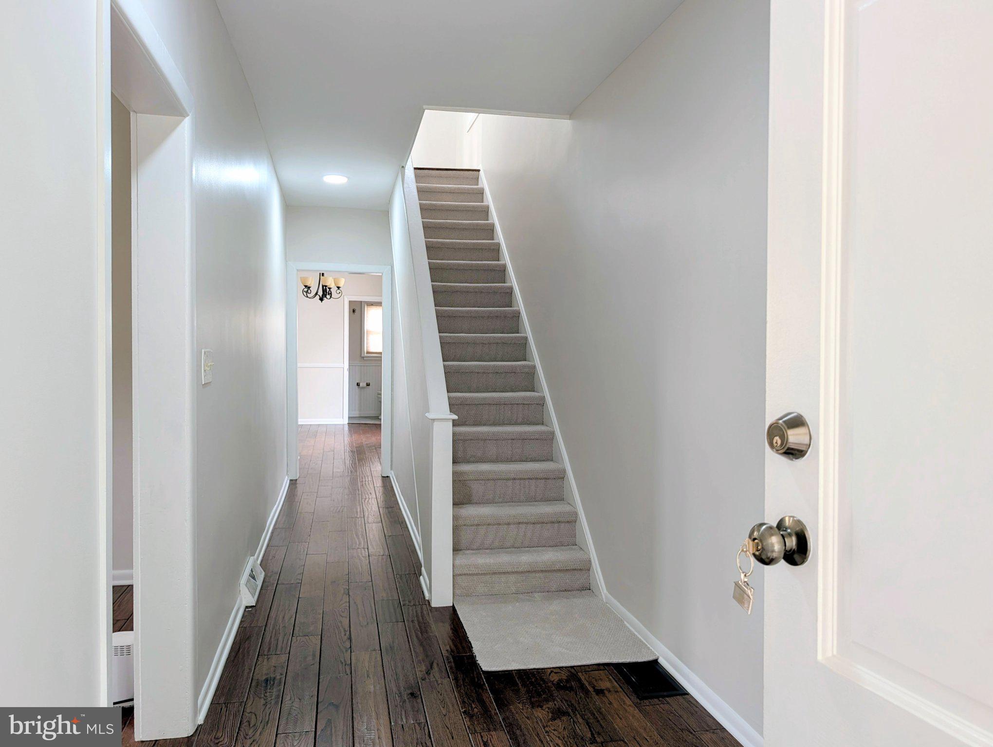 611 Rutledge Avenue Folsom, PA 19033 - Photo 3 of 31 Inviting hallway with elegant staircase.