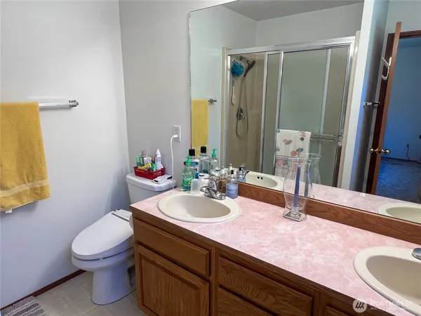 a bathroom with a shower and a sink