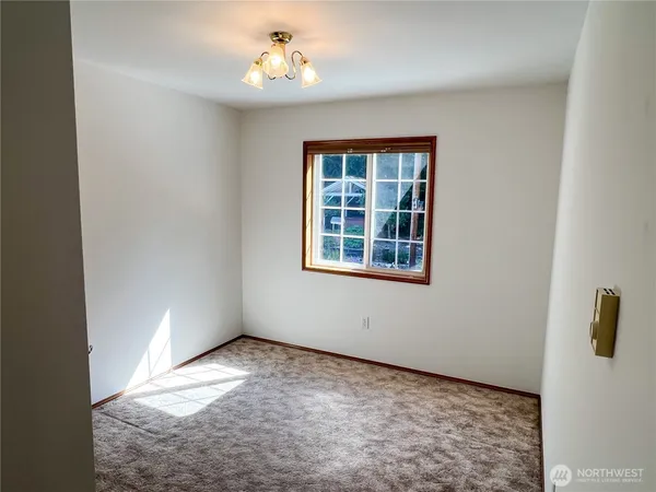 a view of a livingroom with a chandelier fan