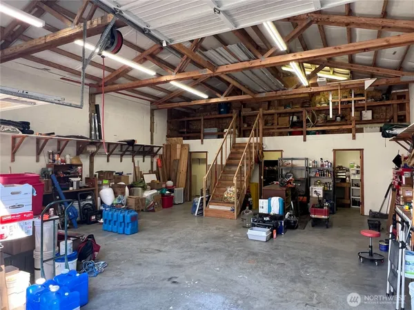 a bathroom with a sink a toilet and shower curtain