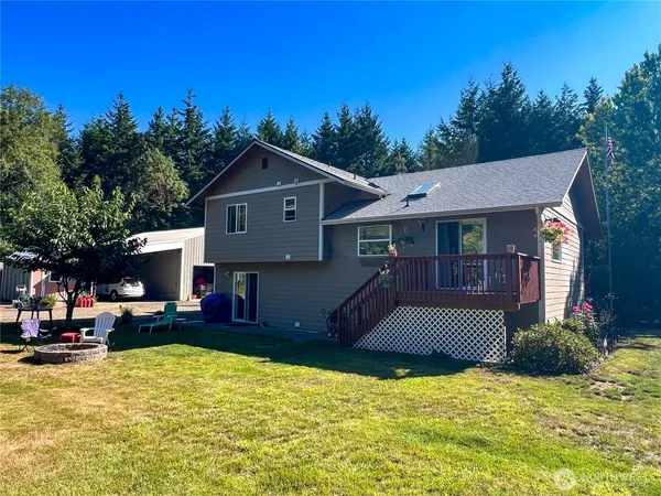 a view of house with outdoor space and garden
