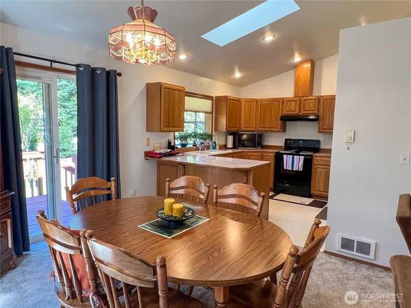 a view of a dining room with furniture window and outside view