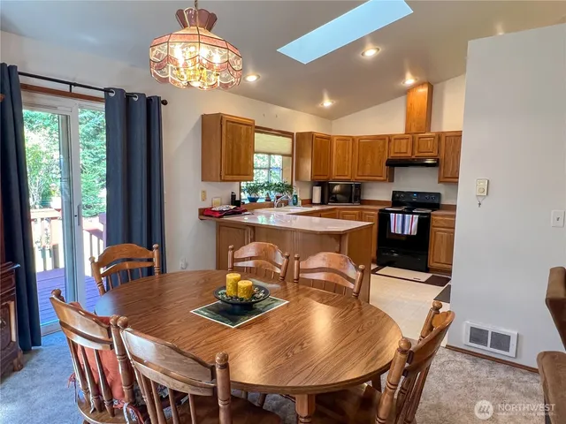a view of room with furniture and windows