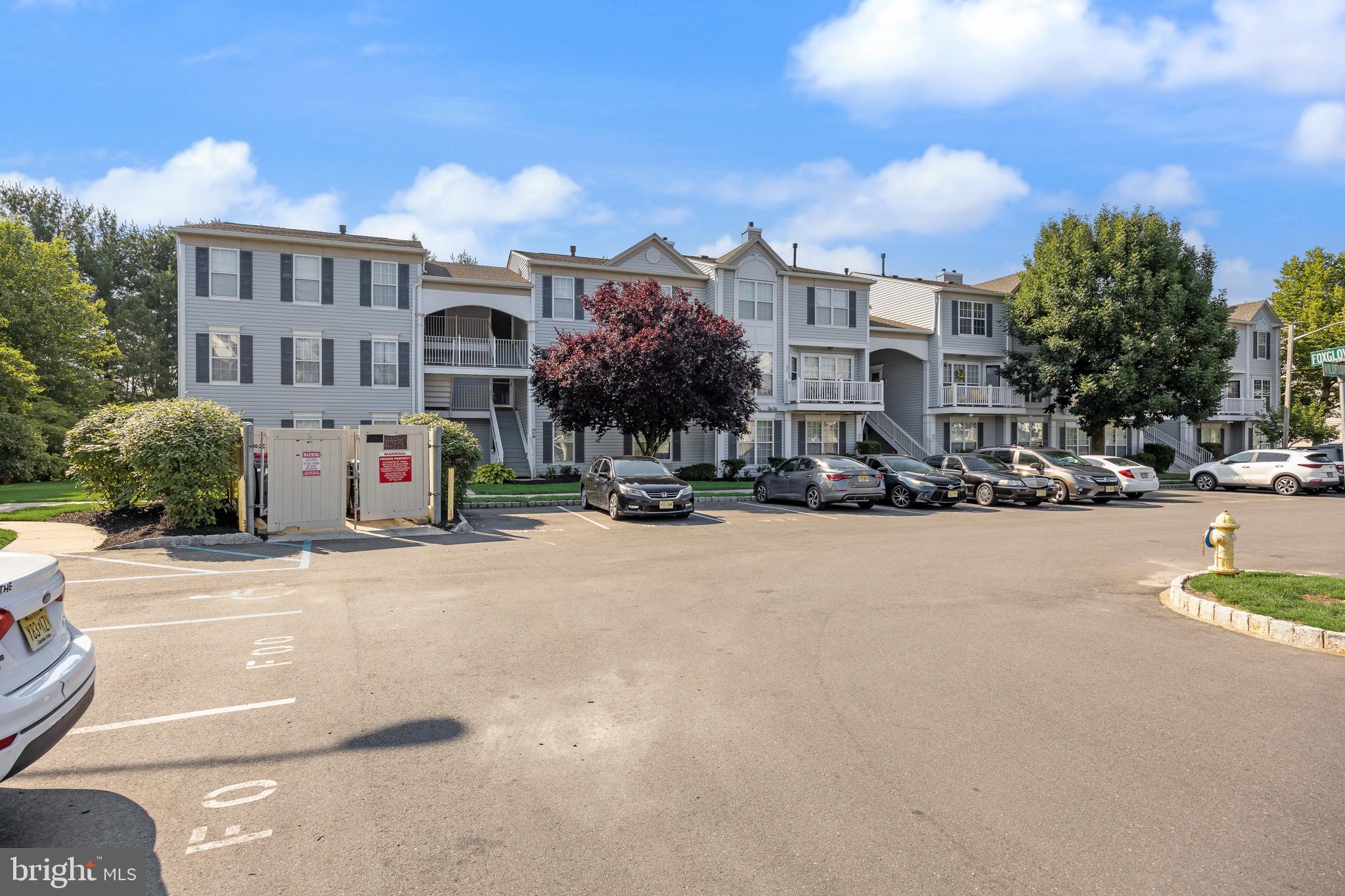 151 Wildflower Place Delran, NJ 08075 - Photo 26 of 29 a view of a street with a building in the background