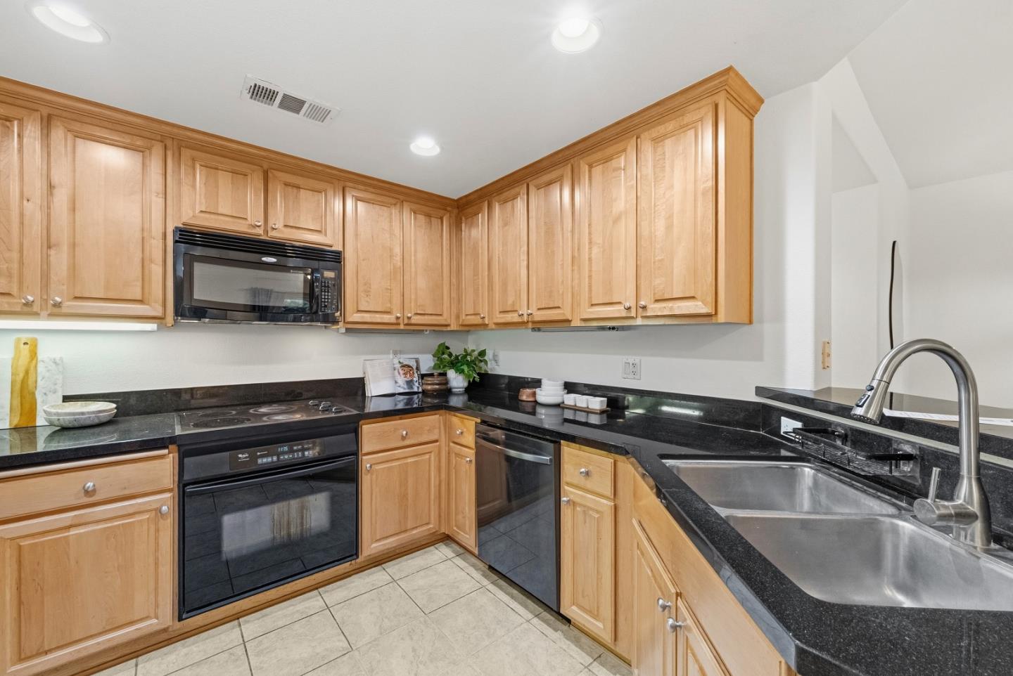 1390 Saddle Rack Street, Unit 223 San Jose, CA 95126 - Photo 9 of 36 a kitchen with granite countertop a sink stainless steel appliances and cabinets