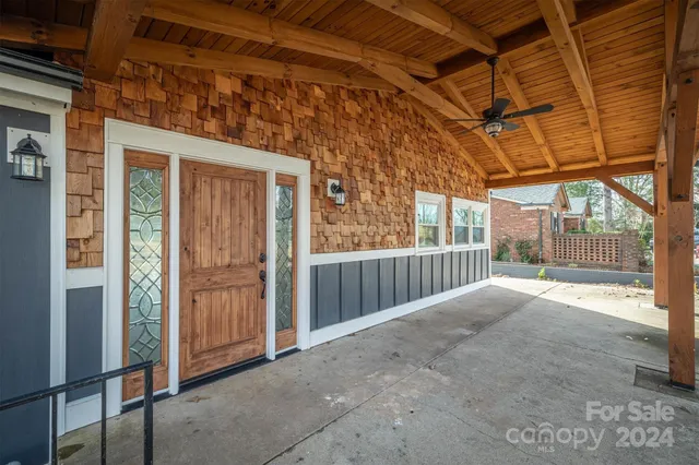 a view of backyard with large tree