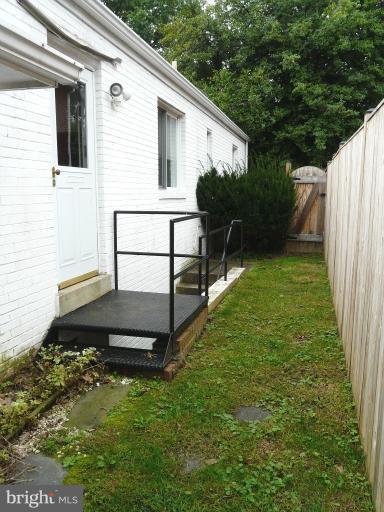 705 Stirling Road Silver Spring, MD 20901 - Photo 11 of 23 a backyard of a house with seating space