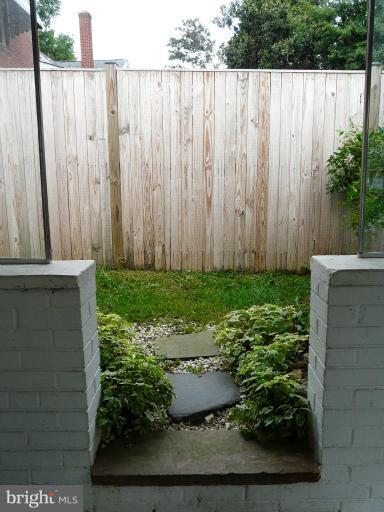 705 Stirling Road Silver Spring, MD 20901 - Photo 13 of 23 a view of a garden with wooden fence
