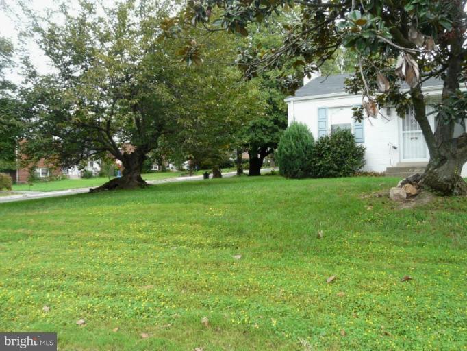 705 Stirling Road Silver Spring, MD 20901 - Photo 16 of 23 a front view of a house with a garden