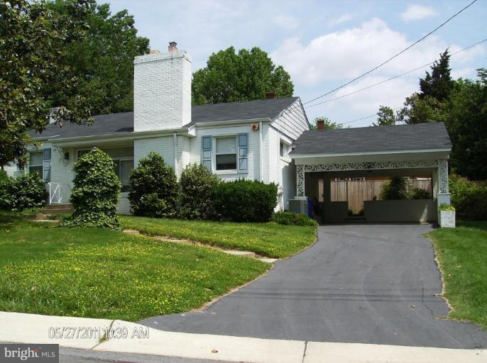 705 Stirling Road Silver Spring, MD 20901 - Photo 8 of 23 a front view of a house with a yard and garage