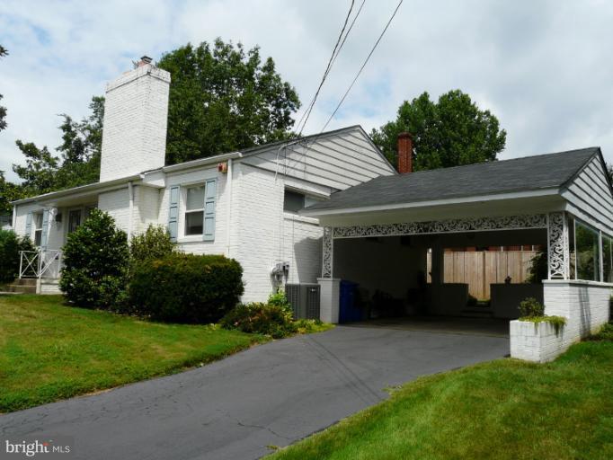 705 Stirling Road Silver Spring, MD 20901 - Photo 9 of 23 a front view of a house with a yard and garage