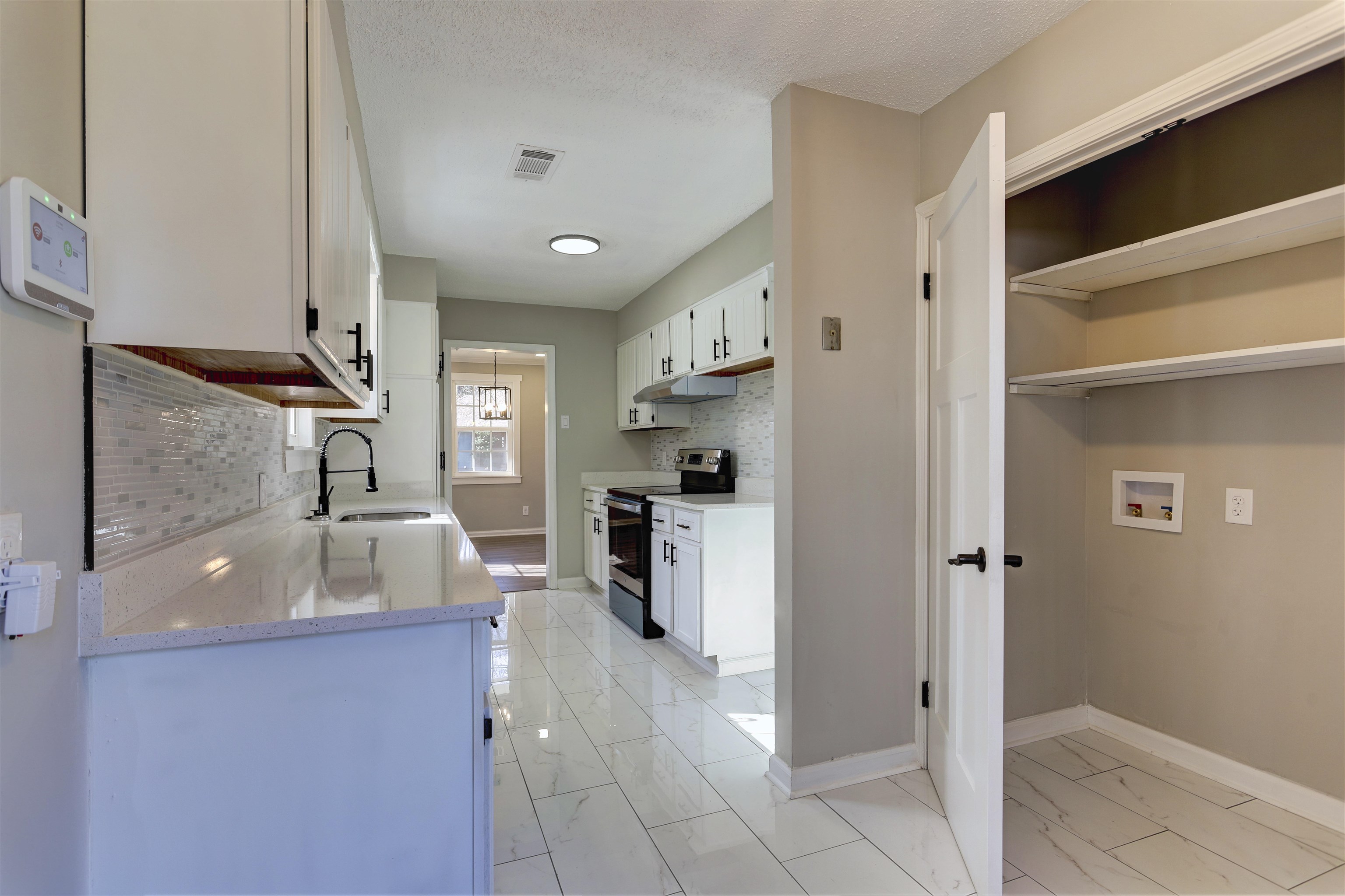 942 Wingfield Road Memphis, TN 38122 - Photo 12 of 24 a kitchen with refrigerator and window