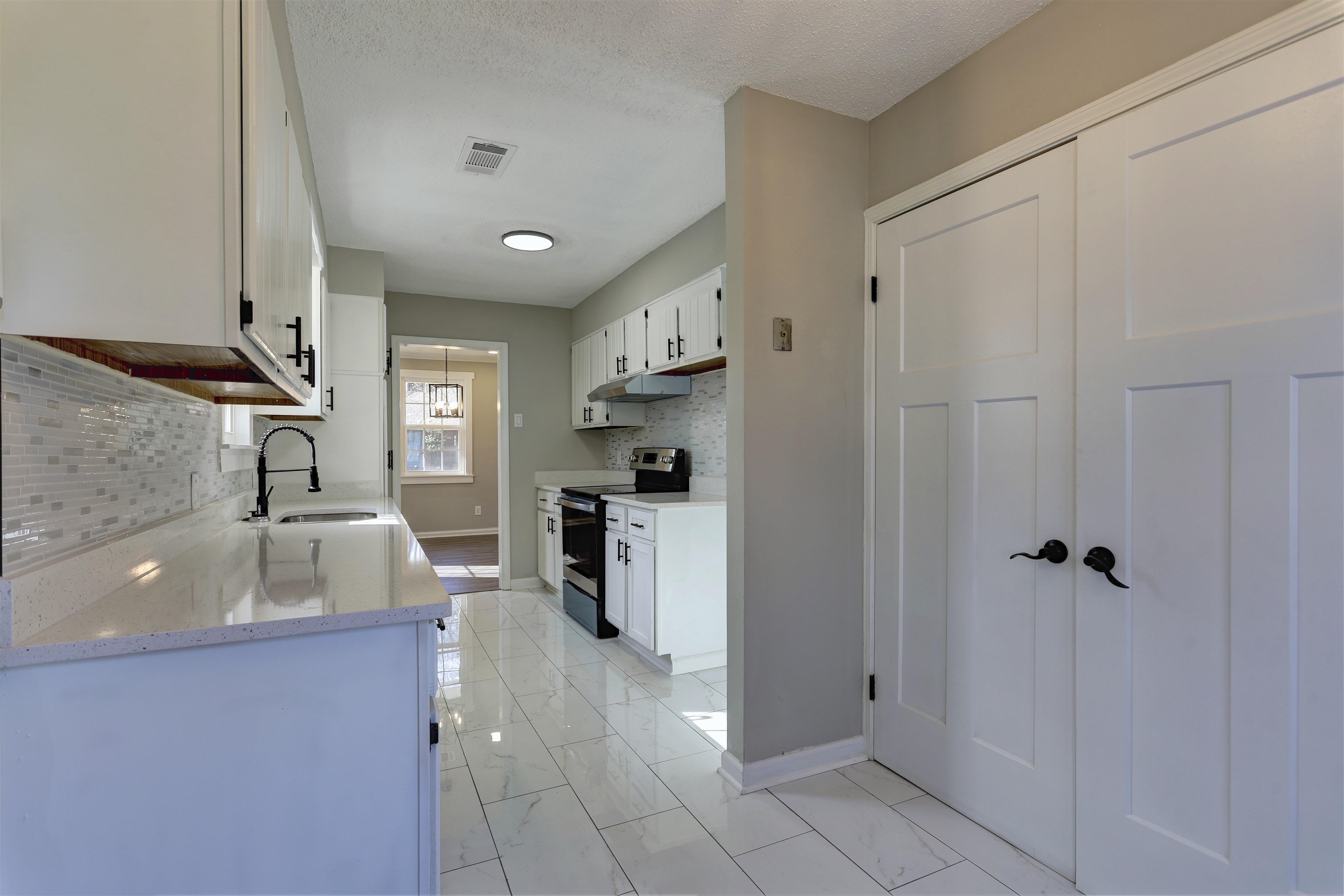 942 Wingfield Road Memphis, TN 38122 - Photo 14 of 24 a kitchen with granite countertop a sink stainless steel appliances and cabinets