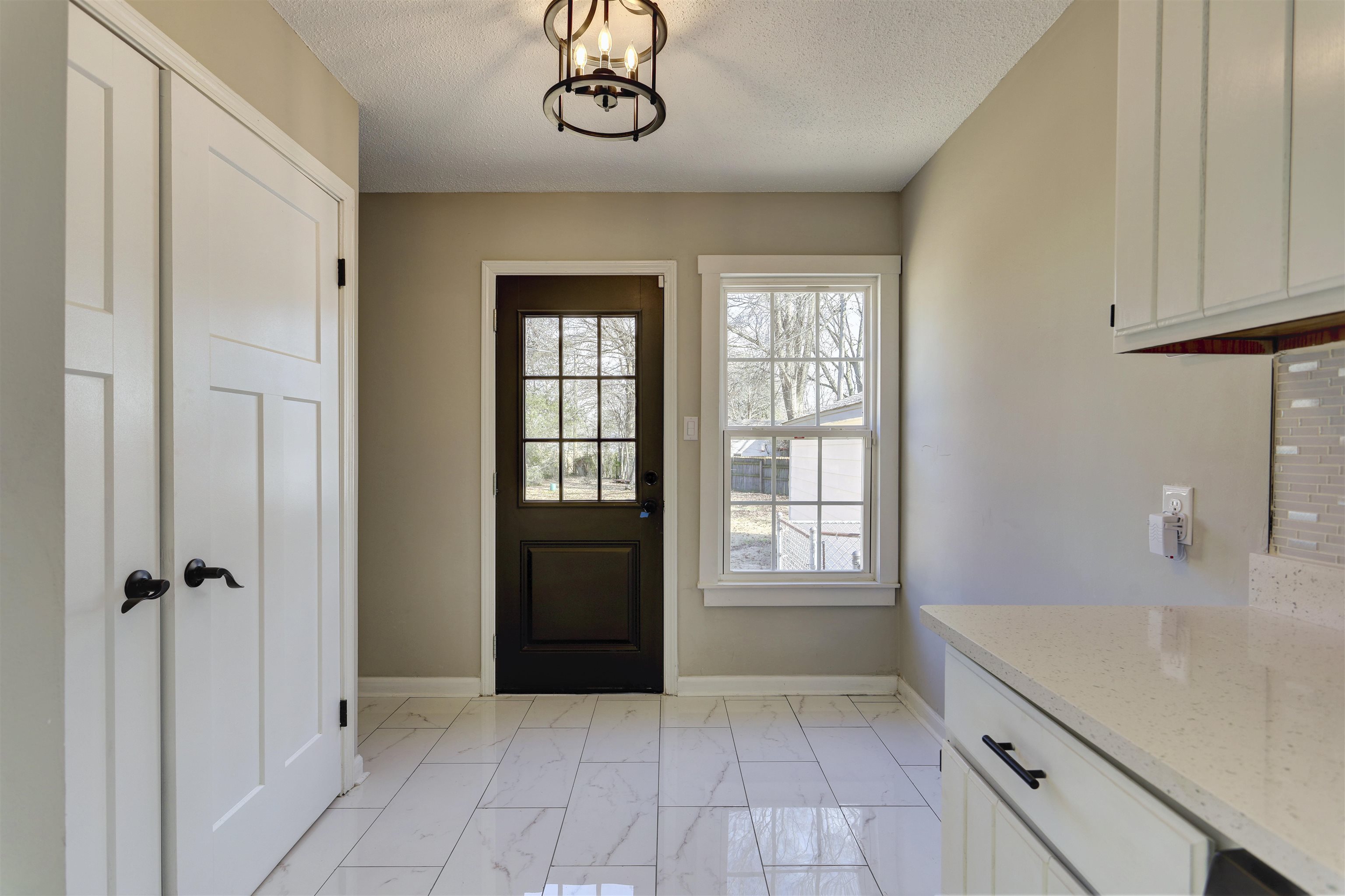 942 Wingfield Road Memphis, TN 38122 - Photo 15 of 24 a bathroom with a granite countertop sink a large mirror and a shower