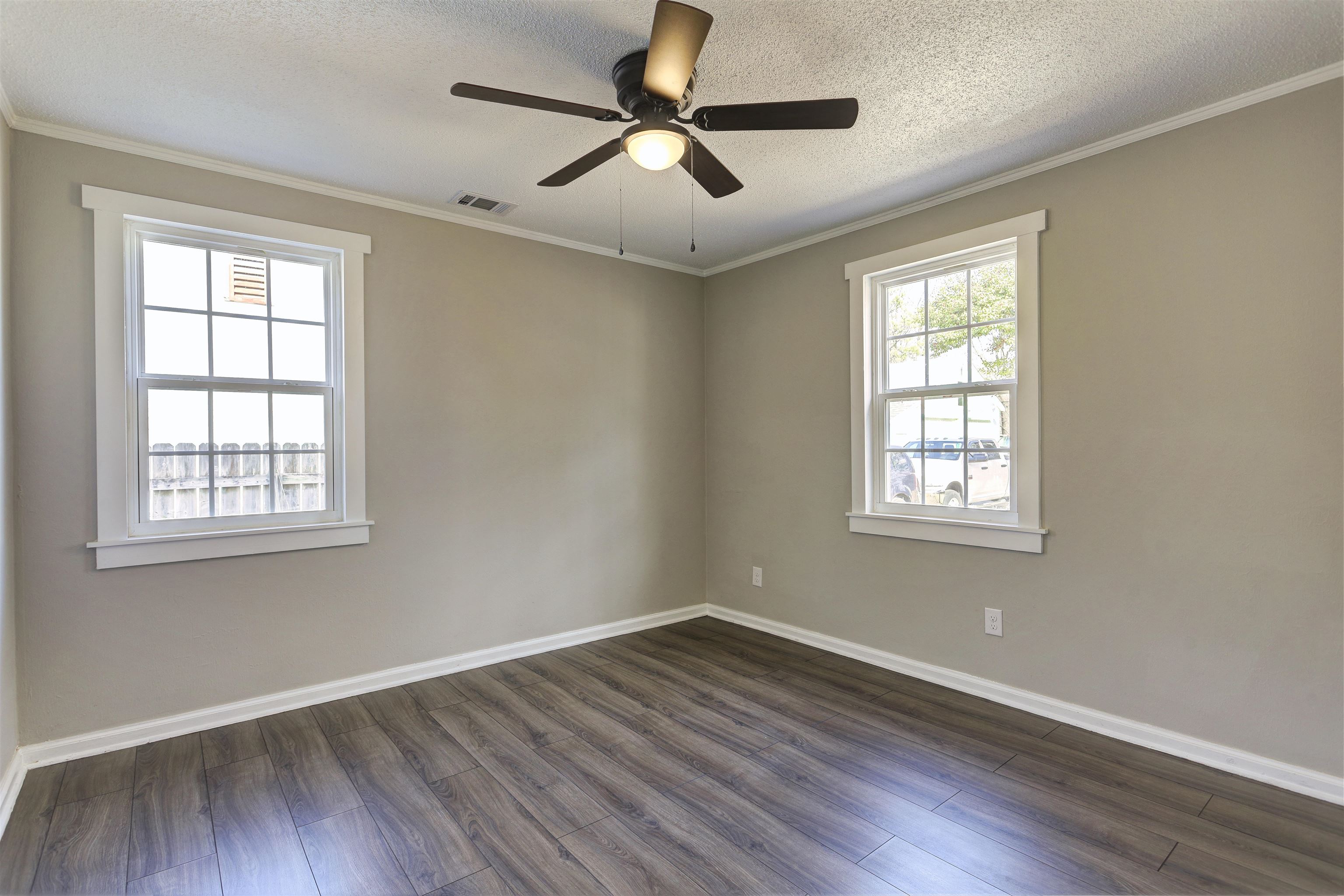 942 Wingfield Road Memphis, TN 38122 - Photo 17 of 24 a view of empty room with wooden floor and fan