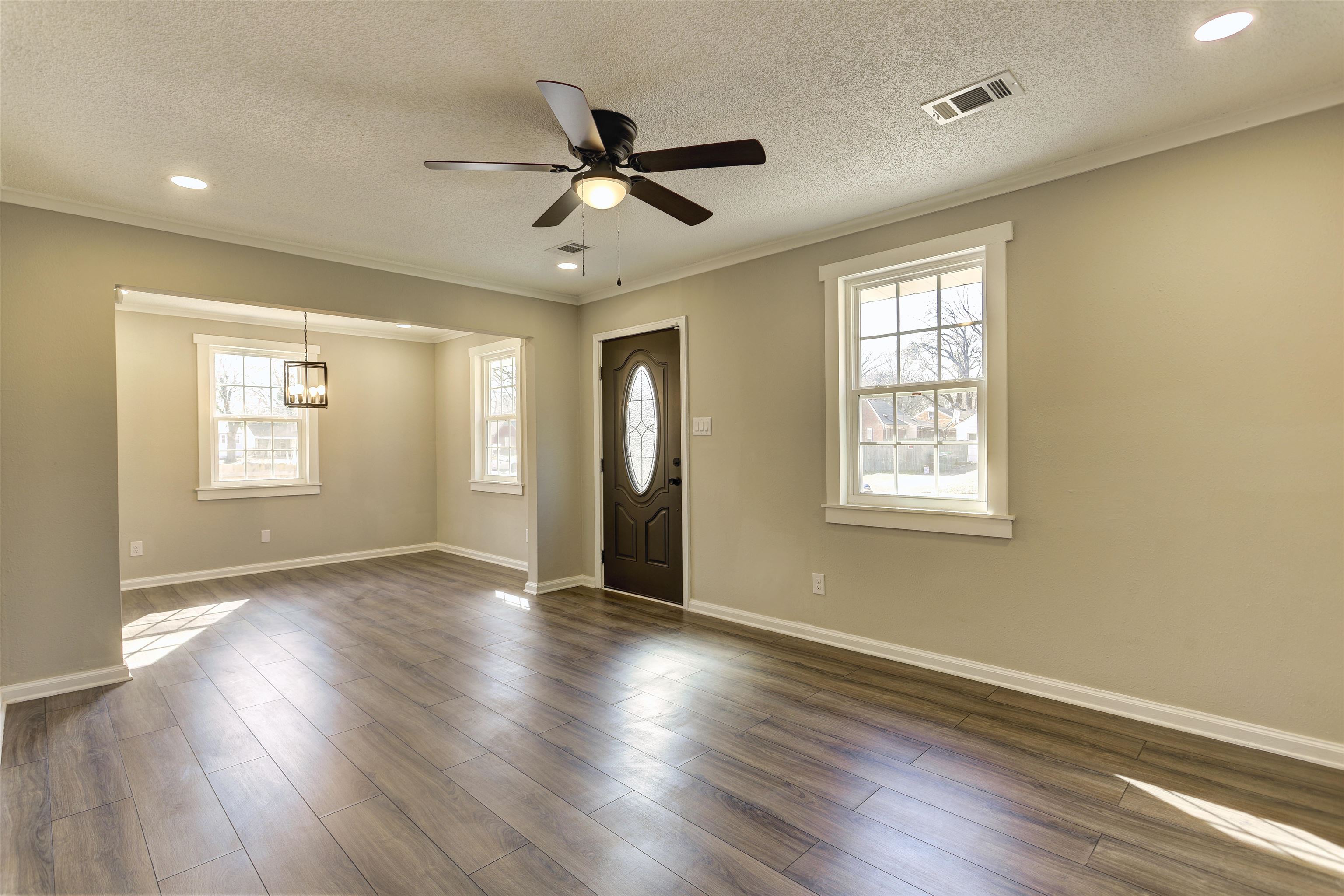 942 Wingfield Road Memphis, TN 38122 - Photo 6 of 24 a view of empty room with wooden floor and fan