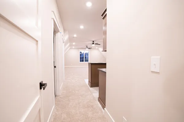 a view of kitchen with stainless steel appliances granite countertop a refrigerator and a sink