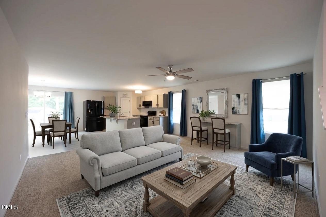 177 Yellowwood Avenue Spring Hope, NC 27882 - Photo 6 of 31 a living room with furniture and view of kitchen