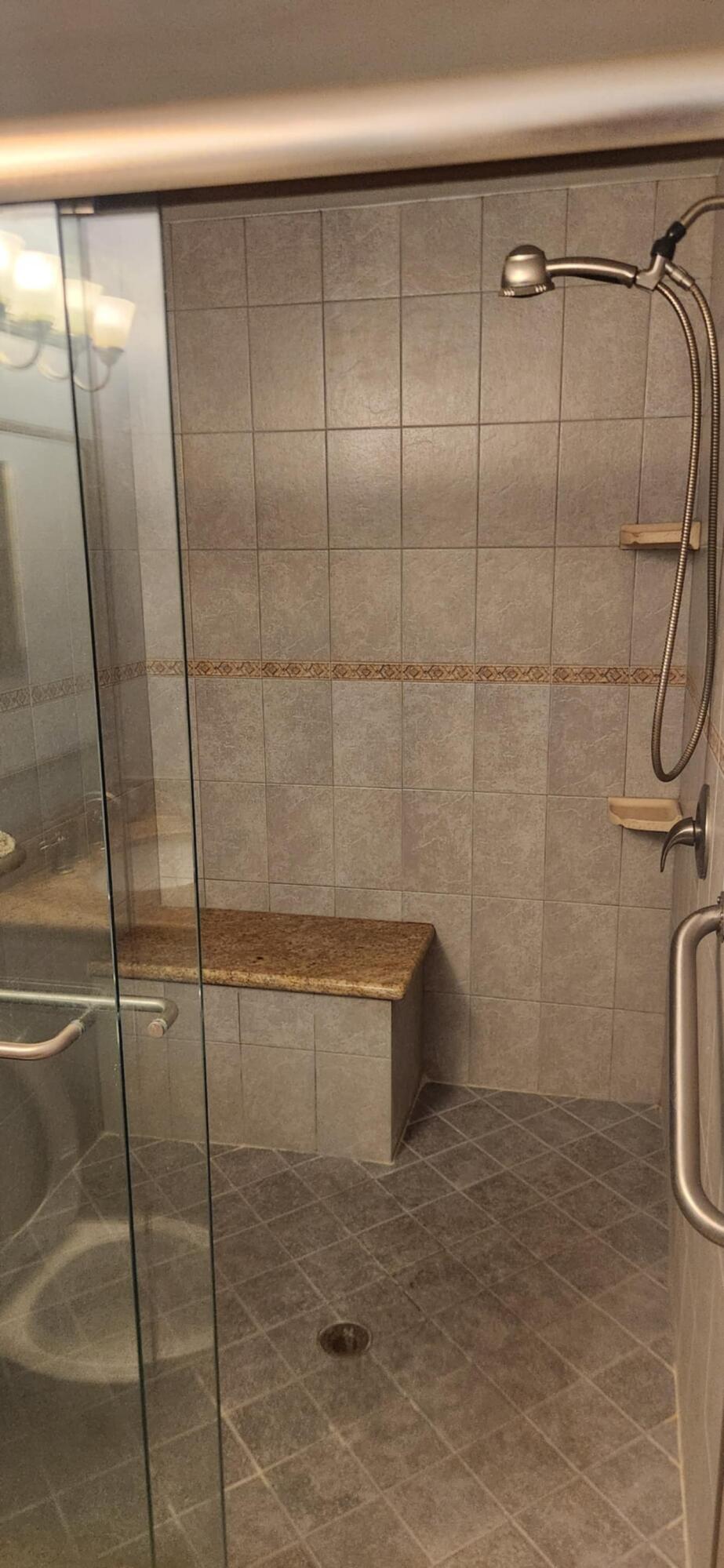 5510 North Ocean Boulevard, Unit 206 Ocean Ridge, FL 33435 - Photo 11 of 23 a bathroom with a shower