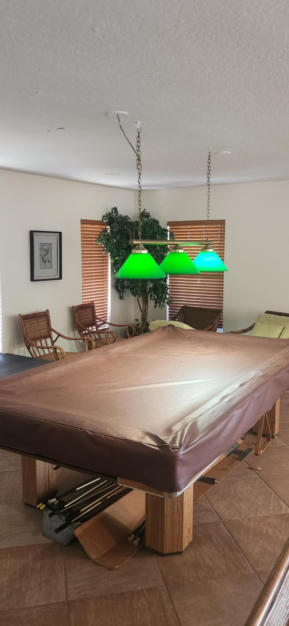 5510 North Ocean Boulevard, Unit 206 Ocean Ridge, FL 33435 - Photo 19 of 23 a room with a table and potted plants