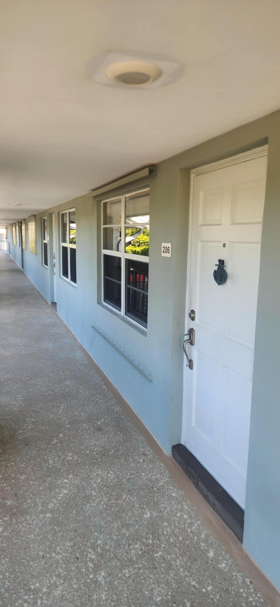 5510 North Ocean Boulevard, Unit 206 Ocean Ridge, FL 33435 - Photo 3 of 23 an empty room with windows