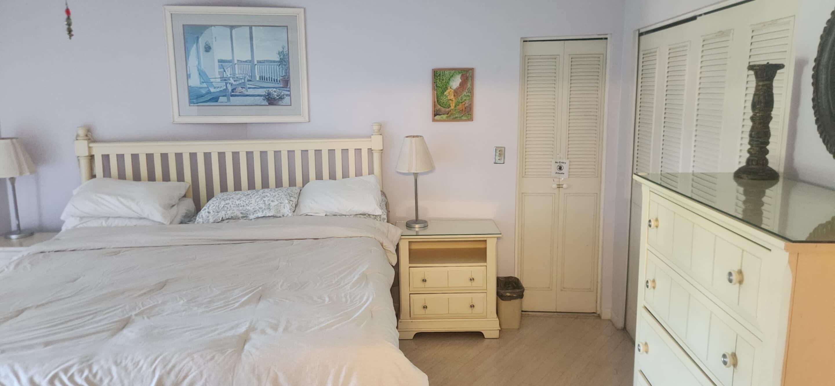 5510 North Ocean Boulevard, Unit 206 Ocean Ridge, FL 33435 - Photo 8 of 23 a bedroom with a bed and furniture