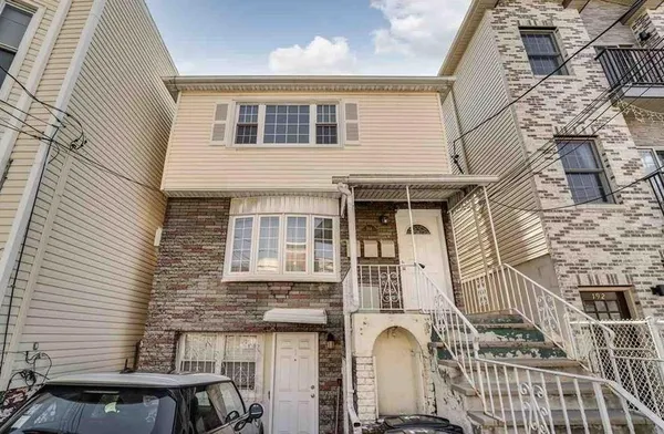 a front view of a house with a balcony