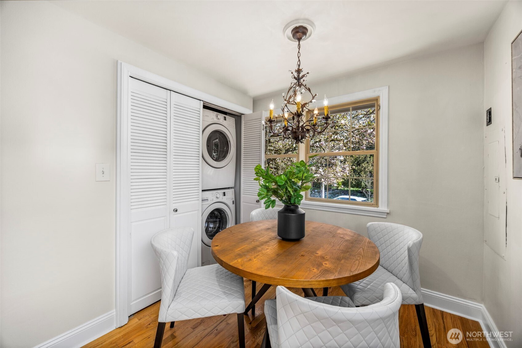 3321 35th Avenue South Seattle, WA 98144 - Photo 12 of 33 a view of a dining room with furniture and chandelier