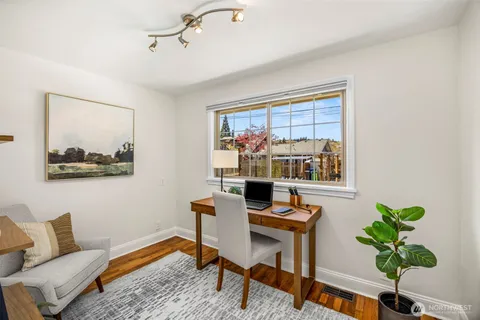 a workspace with furniture and a potted plant
