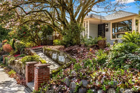 front view of a house with a tree