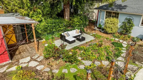 a view of a backyard with sitting area