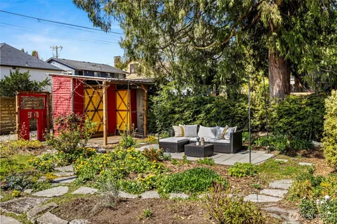 a view of a patio with couches table and chairs and potted plants