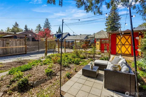 a view of a backyard with sitting area