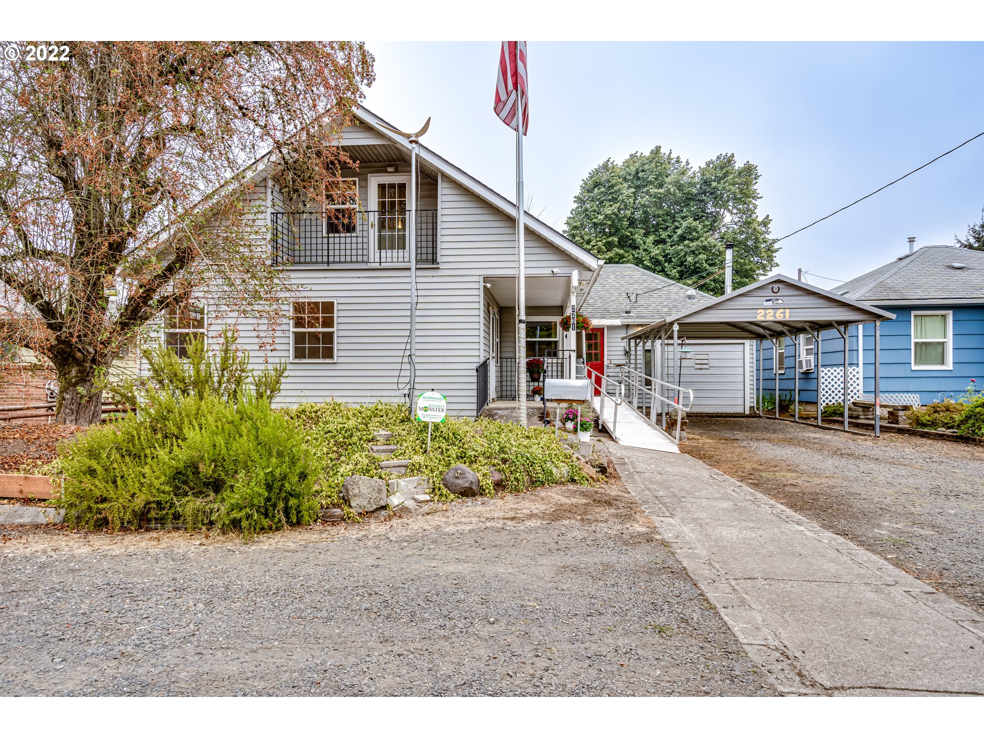 2261 5th Street Springfield, OR 97477 - Photo 1 of 27 a front view of a house with a garden