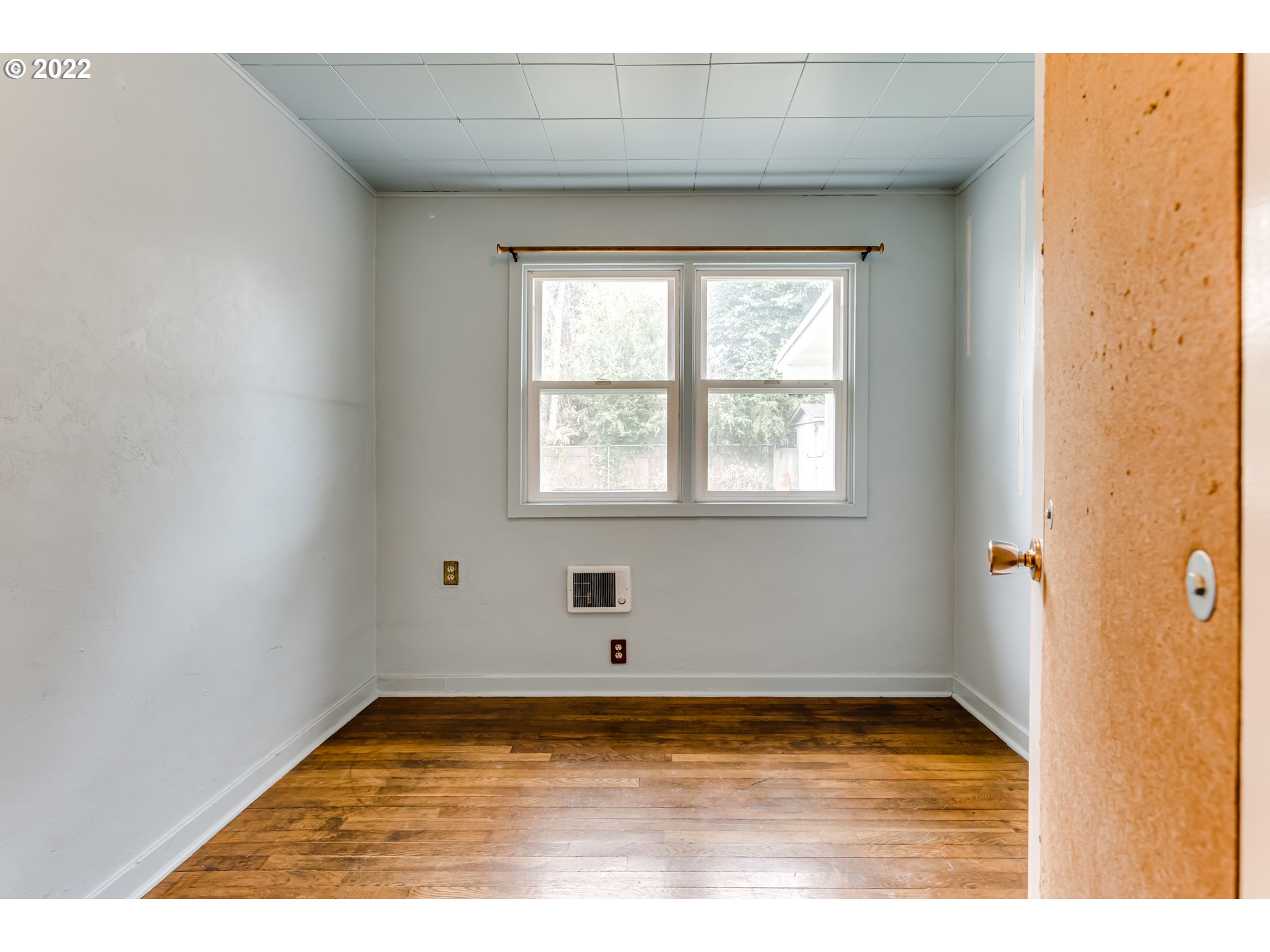 2261 5th Street Springfield, OR 97477 - Photo 17 of 27 a view of empty room with wooden floor and fan