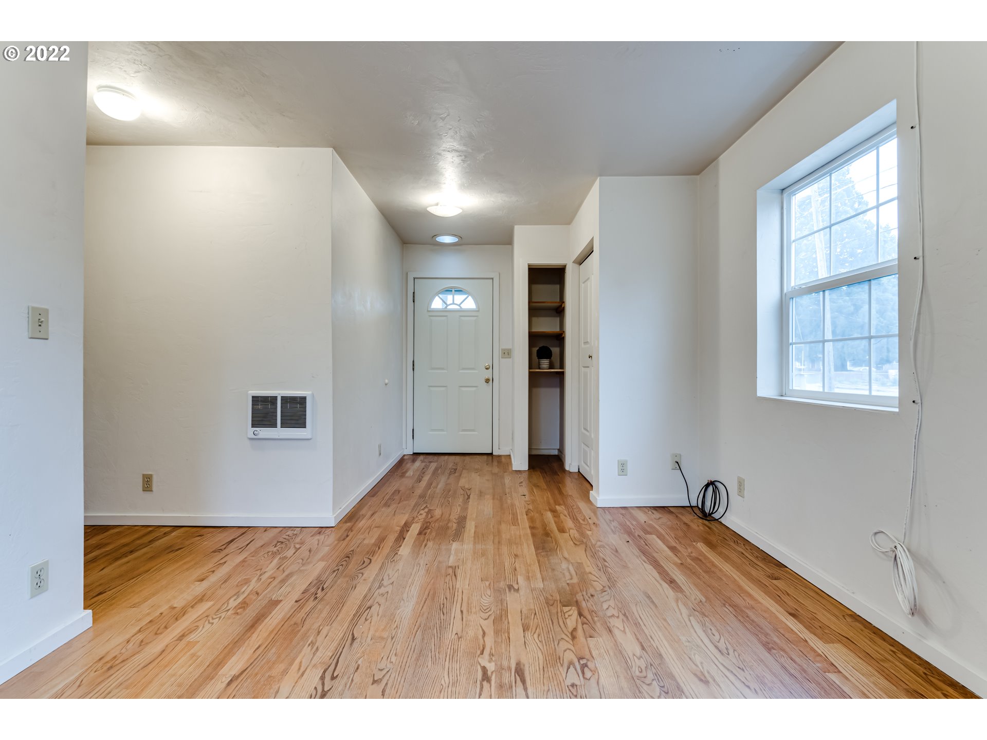 2261 5th Street Springfield, OR 97477 - Photo 5 of 27 a view of an empty room with wooden floor and a window