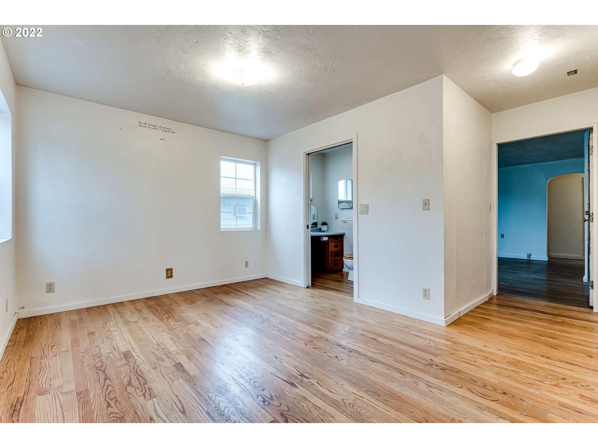 2261 5th Street Springfield, OR 97477 - Photo 7 of 27 an empty room with wooden floor and windows