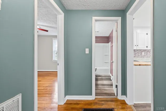 a view of walk in closet with clothes