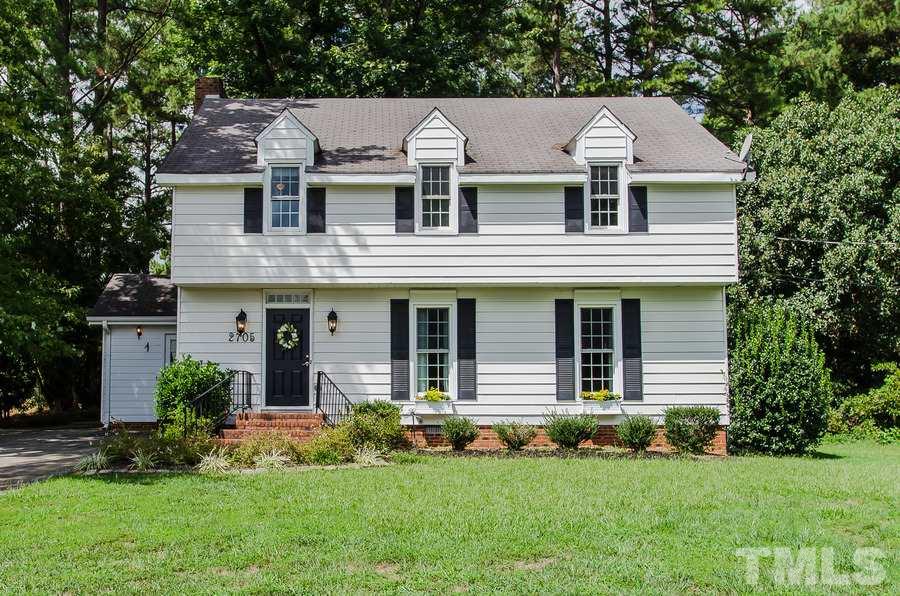 2705 Wycliff Road Raleigh, NC 27607 - Photo 1 of 22 a front view of a house with a garden and plants