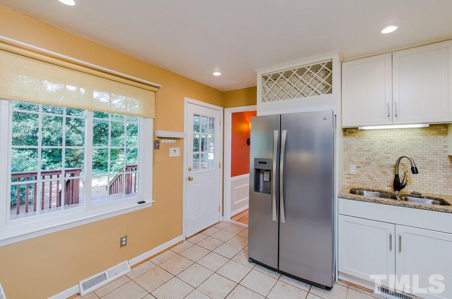 2705 Wycliff Road Raleigh, NC 27607 - Photo 11 of 22 a kitchen with stainless steel appliances granite countertop a refrigerator and a sink
