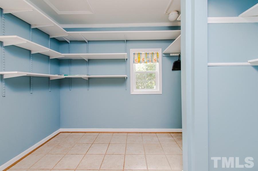 2705 Wycliff Road Raleigh, NC 27607 - Photo 12 of 22 a view of a kitchen with white cabinets and a window