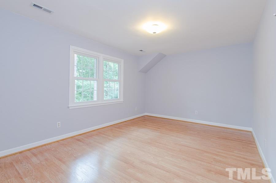 2705 Wycliff Road Raleigh, NC 27607 - Photo 16 of 22 an empty room with a window