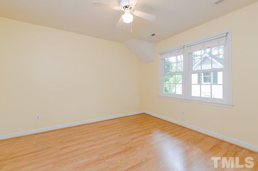 2705 Wycliff Road Raleigh, NC 27607 - Photo 17 of 22 wooden floor in an empty room with a window