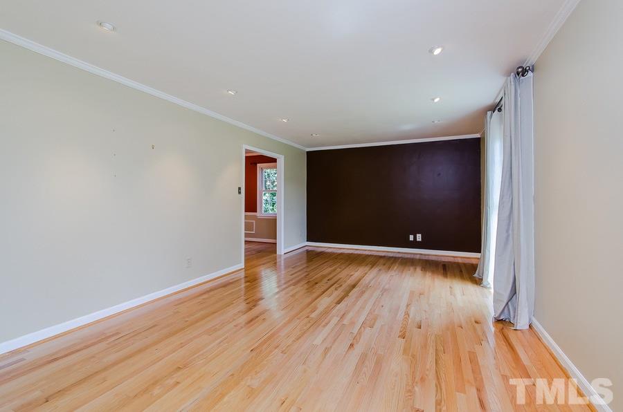 2705 Wycliff Road Raleigh, NC 27607 - Photo 6 of 22 a view of an empty room with wooden floor
