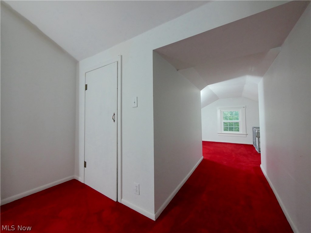 72622 Colerain Road Dillonvale, OH 43917 - Photo 12 of 17 Attic space featuring sloped ceilings, white painted walls, and bright red carpeting