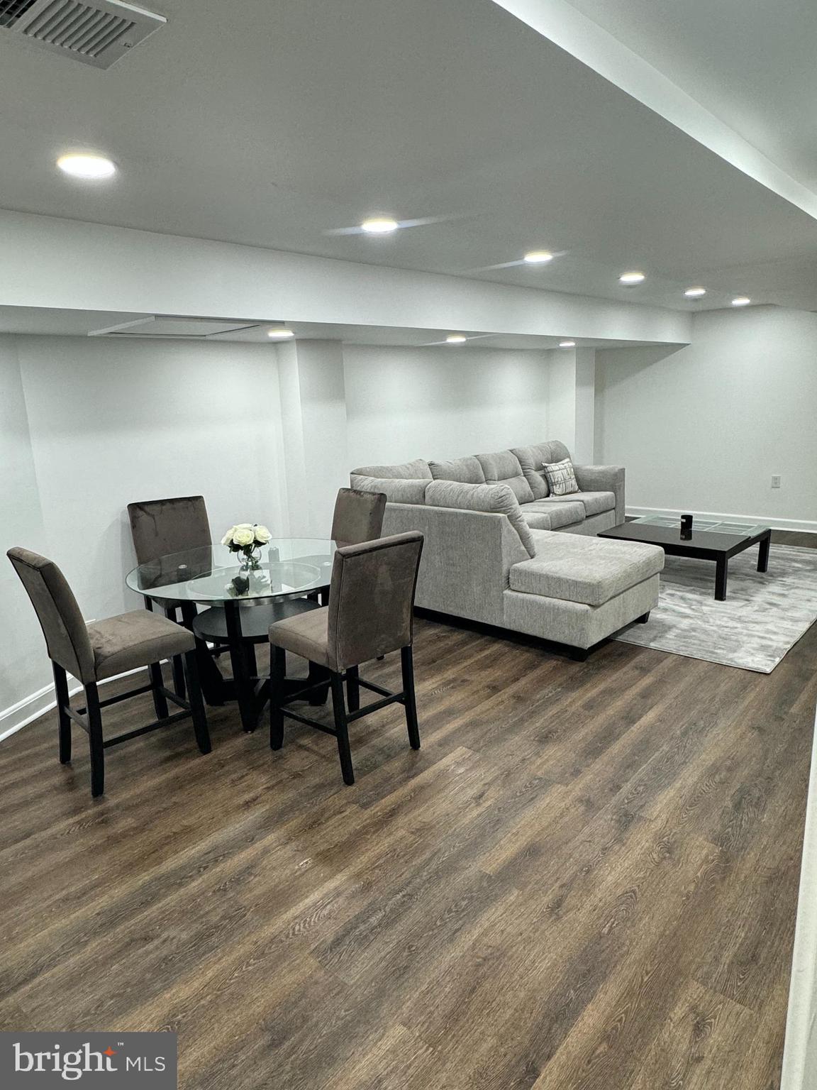 3401 Greenway, Unit 50 Baltimore, MD 21218 - Photo 4 of 12 a living room with furniture and a wooden floor