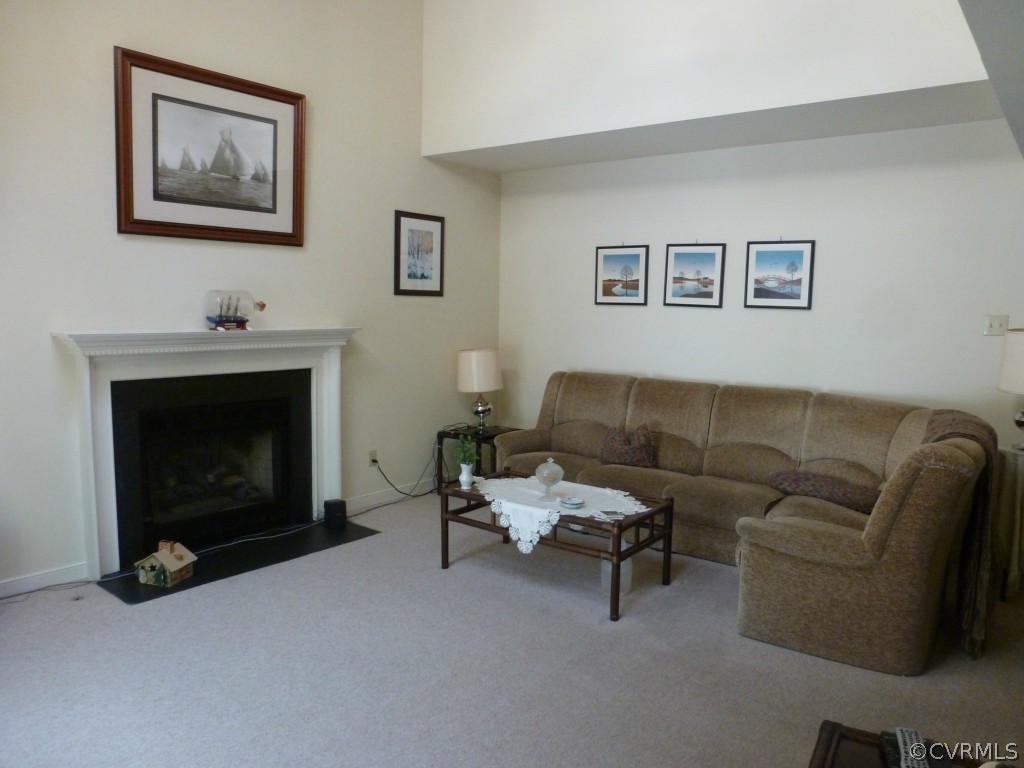 14716 Ridge Point Drive Midlothian, VA 23112 - Photo 3 of 24 a living room with furniture and a fireplace
