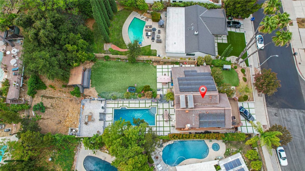 18810 Kirkcolm Lane Porter Ranch, CA 91326 - Photo 34 of 75 an aerial view of a house with a garden and a yard