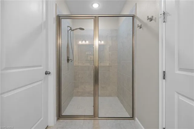 a bathroom with a glass shower door