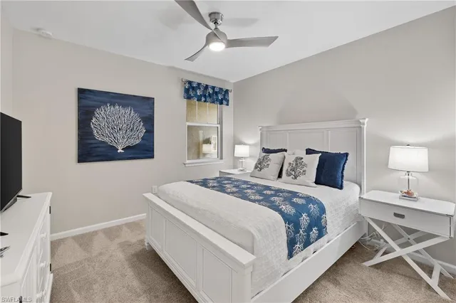 a bed room with a bed and a flat screen tv